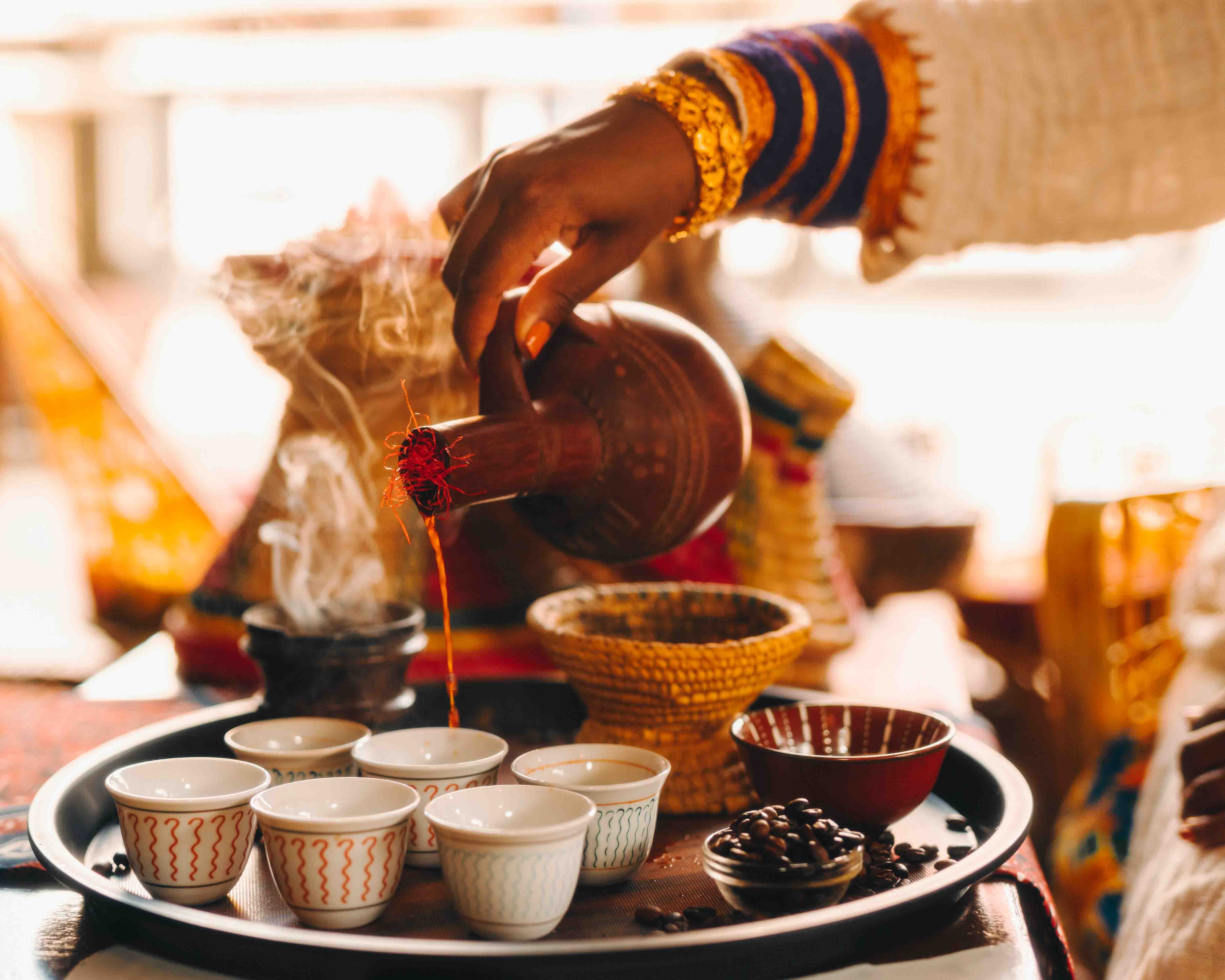 Traditional Ethiopian coffee poured from a clay jebena during the coffee ceremony